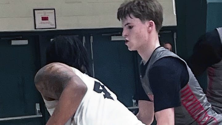 Archbishop Spalding’s Colt Busse (right) defends John Carroll’s Aidan Able during Sunday’s Baltimore Catholic League Tournament quarterfinals at Loyola University. The fourth-seeded Cavaliers never trailed to advance to Monday’s semifinals against top-seeded Saint Frances Academy.