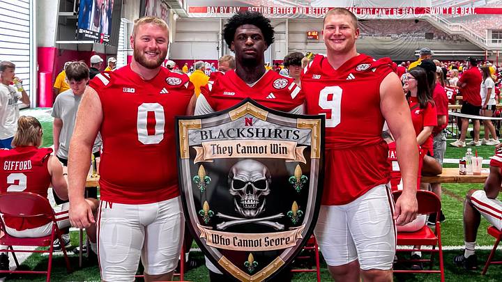 Nash Hutmacher, Jimari Butler and Ty Robinson pose with a Blackshirts shield during 2024 Nebraska football Fan Day. Nash Hutmacher, Jimari Butler and Ty Robinson pose with a Blackshirts shield during 2024 Nebraska football Fan Day.