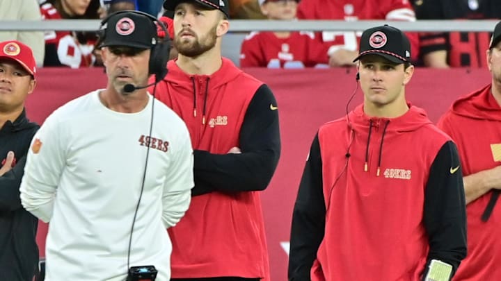 Jan 5, 2025; Glendale, Arizona, USA; San Francisco 49ers quarterback Brock Purdy (right) and head coach Kyle Shanahan (left) look on the in second half against the Arizona Cardinals at State Farm Stadium. Mandatory Credit: Matt Kartozian-Imagn Images Jan 5, 2025; Glendale, Arizona, USA; San Francisco 49ers quarterback Brock Purdy (right) and head coach Kyle Shanahan (left) look on the in second half against the Arizona Cardinals at State Farm Stadium. Mandatory Credit: Matt Kartozian-Imagn Images