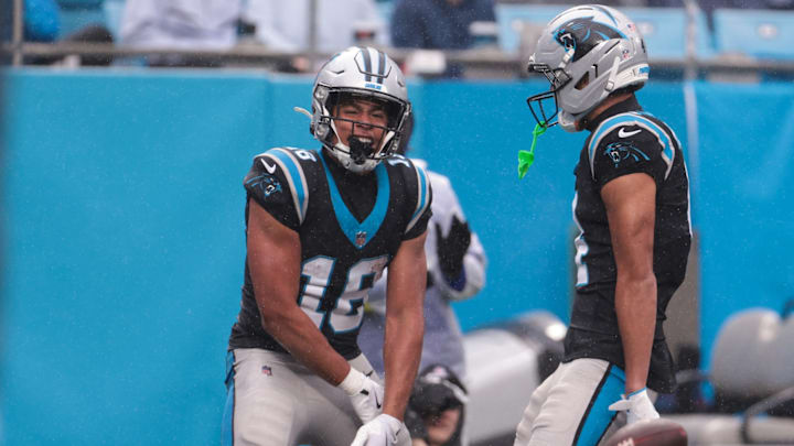 Nov 30, 2025; Charlotte, North Carolina, USA; Carolina Panthers wide receiver Jalen Coker (18) celebrates after scoring a touchdown during the third quarter at Bank of America Stadium. Nov 30, 2025; Charlotte, North Carolina, USA; Carolina Panthers wide receiver Jalen Coker (18) celebrates after scoring a touchdown during the third quarter at Bank of America Stadium.