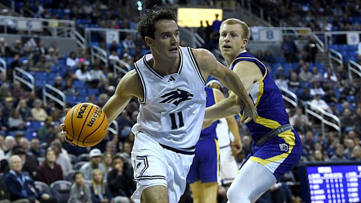 Nevada’s Nick Davidson looks to pass while taking on South Dakota State at Lawlor Events Center in Reno on Dec. 11, 2024.