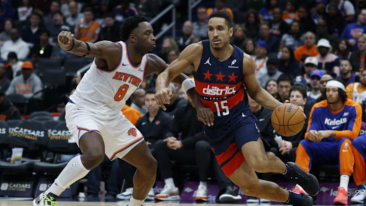 Dec 28, 2024; Washington, District of Columbia, USA; Washington Wizards guard Malcolm Brogdon (15) drives to the basket as New York Knicks forward OG Anunoby (8) defends in the fourth quarter at Capital One Arena. Mandatory Credit: Geoff Burke-Imagn Images