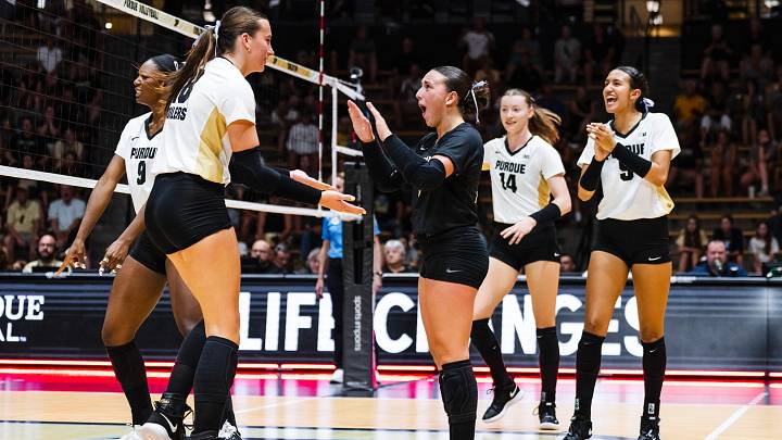 The Purdue volleyball team celebrates a point. The Purdue volleyball team celebrates a point.