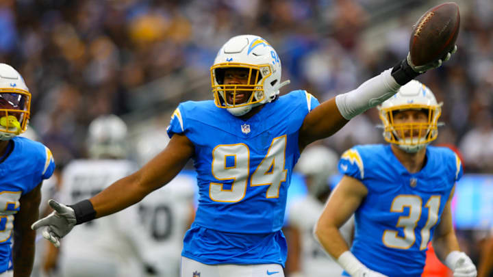 INGLEWOOD, CA - OCTOBER 1: Los Angeles Chargers linebacker Chris Rumph II (94) celebrates after a fumble recovery during the NFL, American Football Herren, USA regular season game between the Las Vegas Raiders and the Los Angeles Chargers on October 1, 2023, at SoFi Stadium in Inglewood, CA. INGLEWOOD, CA - OCTOBER 1: Los Angeles Chargers linebacker Chris Rumph II (94) celebrates after a fumble recovery during the NFL, American Football Herren, USA regular season game between the Las Vegas Raiders and the Los Angeles Chargers on October 1, 2023, at SoFi Stadium in Inglewood, CA.