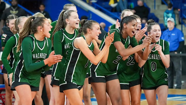 Wachusett players celebrate winning the Division 1 state championship after defeating Springfield Central March 14 at the Tsongas Center in Lowell.