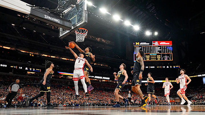 Michigan’s Trey McKenney blocks a shot by Arizona’s Brayden Burries during the men’s Final Four. Michigan’s Trey McKenney blocks a shot by Arizona’s Brayden Burries during the men’s Final Four.
