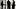 Three businesspeople in corridor by large windows Three businesspeople in corridor by large windows