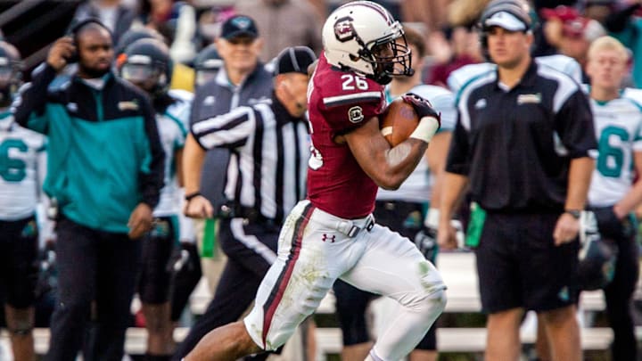 Nov 23, 2013; Columbia, SC, USA; South Carolina Gamecocks running back Jamari Smith (26) rushes for a 52 yard gain against the Coastal Carolina Chanticleers in the second half at Williams-Brice Stadium. Mandatory Credit: Jeff Blake-USA TODAY