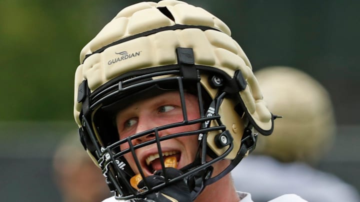 Purdue Boilermakers defensive back Ty Hudkins (25) adjusts his mouthguard 