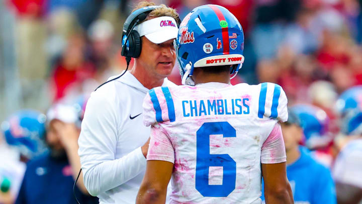 Oct 25, 2025; Norman, Oklahoma, USA;  Ole Miss Rebels head coach Lane Kiffin speaks with Ole Miss Rebels quarterback Trinidad Chambliss (6) during the second half at Gaylord Family-Oklahoma Memorial Stadium. Mandatory Credit: Kevin Jairaj-Imagn Images