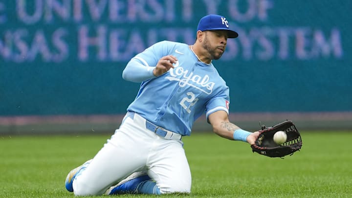 Sep 22, 2024; Kansas City, Missouri, USA; Kansas City Royals left fielder Tommy Pham (22) makes a sliding catch during the fifth inning against the San Francisco Giants at Kauffman Stadium. Mandatory Credit: Jay Biggerstaff-Imagn Images