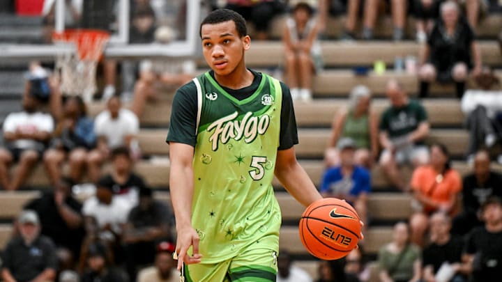 Team Faygo and Michigan State's Divine Ugochukwu moves the ball against Team Motorcars during the Moneyball Pro-Am on Tuesday, June 24, 2025, at Holt High School.