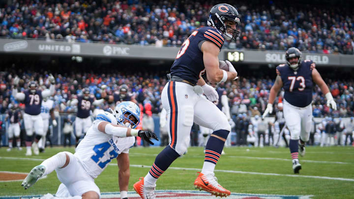 Cole Kmet hauls in a touchdown pass against the Lions last season. 