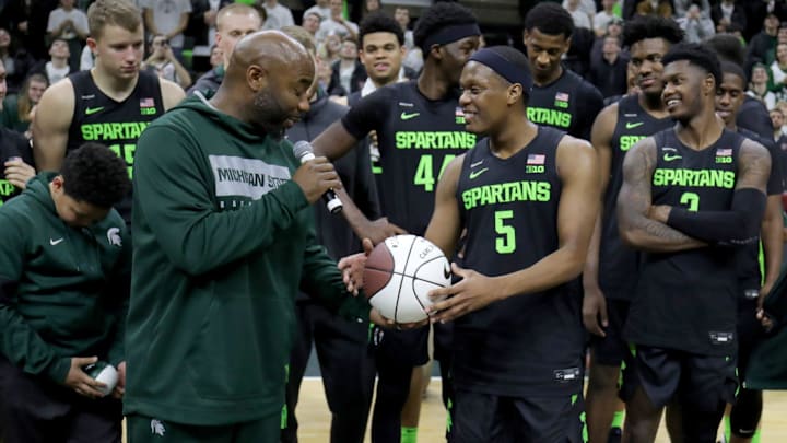 Mateen Cleaves presents Michigan State guard Cassius Winston with a ceremonial ball after Winston broke his assist record during the 67-55 win over Wisconsin at the Breslin Center in East Lansing, Friday, Jan. 17, 2020.

Msu 011720 Kd Kd690
