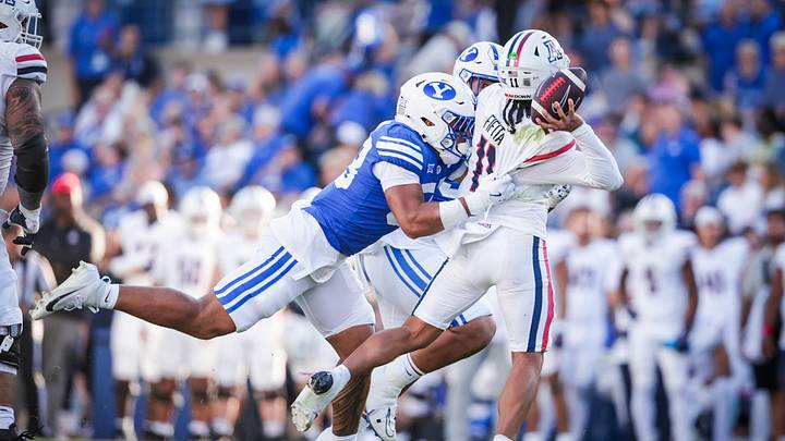 BYU linebacker Aisea Moa pressures Arizona quarterback Noah Fifita as BYU takes down the Wildcats 41-19 BYU linebacker Aisea Moa pressures Arizona quarterback Noah Fifita as BYU takes down the Wildcats 41-19