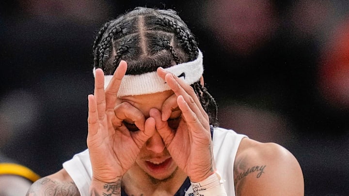 Illinois Fighting Illini guard Tre White (22) celebrates scoring a three-point basket Thursday, March 13, 2025, during the second round of the men's Big Ten tournament at Gainbridge Fieldhouse in Indianapolis. The Illinois Fighting Illini defeated the Iowa Hawkeyes, 106-94. Illinois Fighting Illini guard Tre White (22) celebrates scoring a three-point basket Thursday, March 13, 2025, during the second round of the men's Big Ten tournament at Gainbridge Fieldhouse in Indianapolis. The Illinois Fighting Illini defeated the Iowa Hawkeyes, 106-94.