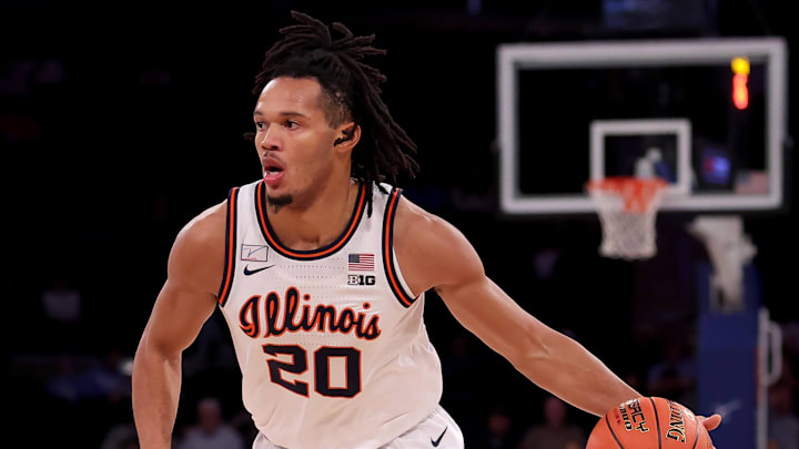 Dec 5, 2023; New York, New York, USA;  Illinois Fighting Illini forward Ty Rodgers (20) drives to the basket against the Florida Atlantic Owls during the first half at Madison Square Garden. Mandatory Credit: Brad Penner-Imagn Images