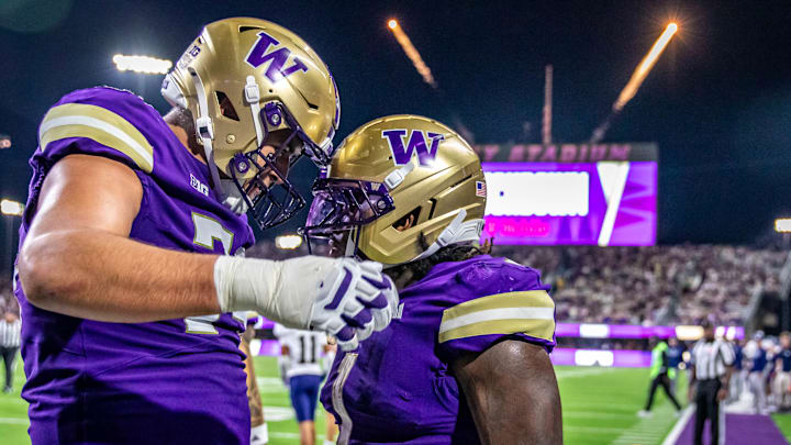 Drew Azzopardi and Jonah Coleman share a Husky moment.