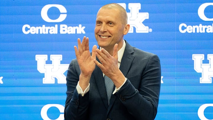 University of Kentucky’s new men’s basketball coach Mark Pope applauds as Athletic Director Mitch Barnhart introduces him to the thousands of fans in Rupp Arena for his press conference on Sunday, April 14, 2024.