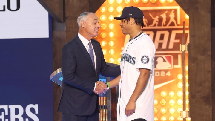 MLB Commissioner Rob Manfred takes a photo with Jurrangelo Cijntje after being drafted by the Seattle Mariners with the 15th pick during the first round on Sunday. MLB Commissioner Rob Manfred takes a photo with Jurrangelo Cijntje after being drafted by the Seattle Mariners with the 15th pick during the first round on Sunday.