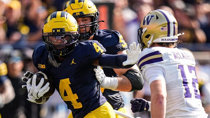 Michigan wide receiver Andrew Marsh (4) runs against Washington safety Alex McLaughlin (12) during the first half at Michigan Stadium in Ann Arbor on Saturday, Oct. 18, 2025.