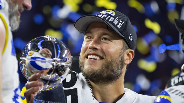 Feb 13, 2022; Inglewood, CA, USA; Los Angeles Rams quarterback Matthew Stafford celebrates with the Lombardi Trophy after defeating the Cincinnati Bengals in Super Bowl LVI at SoFi Stadium. Mandatory Credit: Mark J. Rebilas-Imagn Imagesf