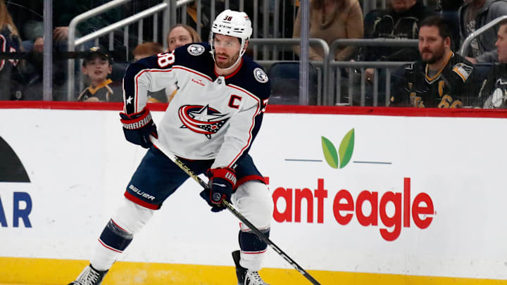 Mar 28, 2024; Pittsburgh, Pennsylvania, USA;  Columbus Blue Jackets center Boone Jenner (38) handles the puck against the Pittsburgh Penguins during the first period at PPG Paints Arena. Mandatory Credit: Charles LeClaire-Imagn Images