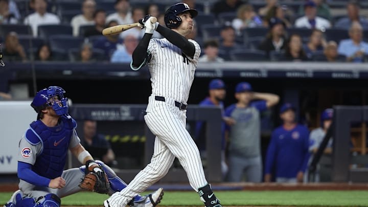 Jul 11, 2025; Bronx, New York, USA;  New York Yankees center fielder Cody Bellinger (35) hits a two run home run in the fifth inning against the Chicago Cubs at Yankee Stadium. Mandatory Credit: Wendell Cruz-Imagn Images