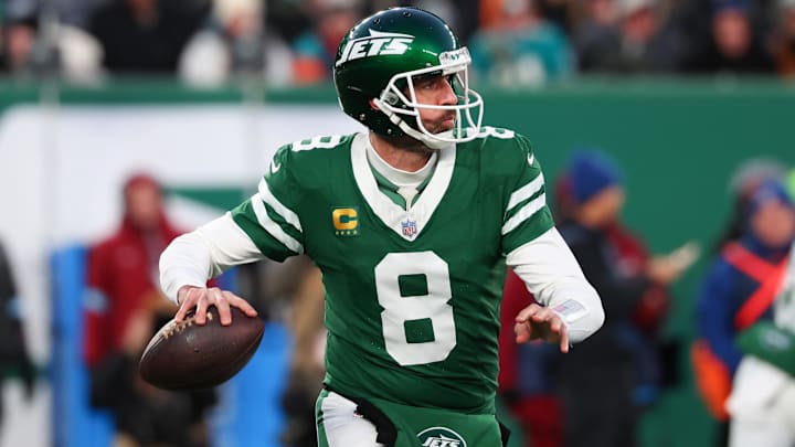 Jan 5, 2025; East Rutherford, New Jersey, USA; New York Jets quarterback Aaron Rodgers (8) throws a pass during the first quarter of their game against the Miami Dolphins at MetLife Stadium. Mandatory Credit: Ed Mulholland-Imagn Images