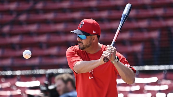 Aug 11, 2024; Boston, Massachusetts, USA; Boston Red Sox bench coach Ramon Vazquez (60) warms up the team before a game against the Houston Astros at Fenway Park. Mandatory Credit: Eric Canha-Imagn Images