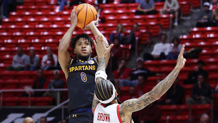 Nov 3, 2025; Salt Lake City, Utah, USA; San Jose State Spartans guard Colby Garland (0) shoots over Utah Utes guard Terrence Brown (2) during the first half at Jon M. Huntsman Center. Mandatory Credit: Rob Gray-Imagn Images