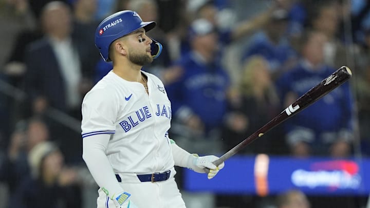 Nov 1, 2025; Toronto, Ontario, CAN; Toronto Blue Jays designated hitter Bo Bichette (11) hits a three run home run against the Los Angeles Dodgers in the third inning during game seven of the 2025 MLB World Series at Rogers Centre.