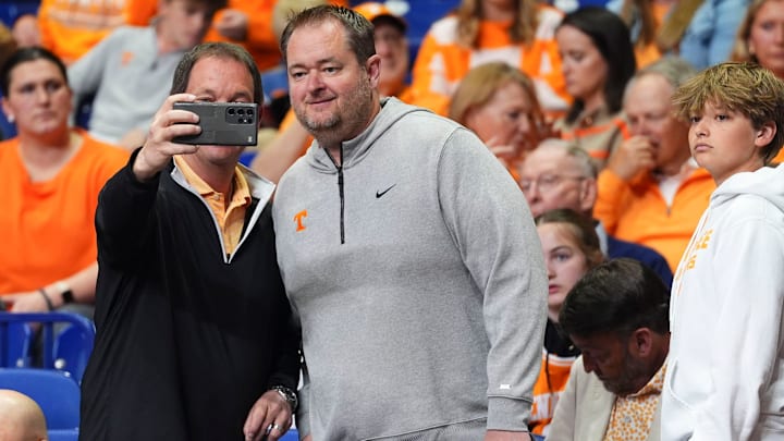 A Tennessee fan takes a photos with Tennessee football coach Josh Heupel at the NCAA Tournament Elite Eight game between Tennessee and Houston at Lucas Oil Stadium in Indianapolis, Ind., on Sunday, March 30, 2025. A Tennessee fan takes a photos with Tennessee football coach Josh Heupel at the NCAA Tournament Elite Eight game between Tennessee and Houston at Lucas Oil Stadium in Indianapolis, Ind., on Sunday, March 30, 2025.