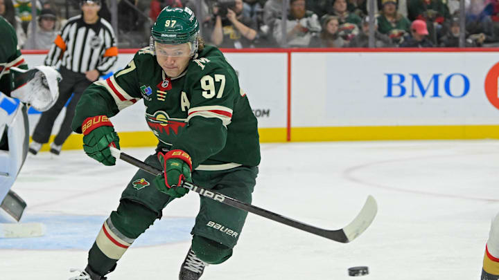 Dec 15, 2024; Saint Paul, Minnesota, USA;  Minnesota Wild forward Kirill Kaprizov (97) makes a pass against The Vegas Golden Knights during the third period at Xcel Energy Center. Mandatory Credit: Nick Wosika-Imagn Images
