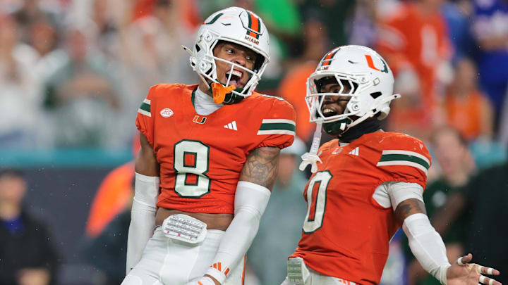 Sep 20, 2025; Miami Gardens, Florida, USA; Miami Hurricanes defensive back Jakobe Thomas (8) defensive back Keionte Scott (0) after sacking Florida Gators quarterback DJ Lagway (not pictured) during the second quarter at Hard Rock Stadium. Mandatory Credit: Sam Navarro-Imagn Images Sep 20, 2025; Miami Gardens, Florida, USA; Miami Hurricanes defensive back Jakobe Thomas (8) defensive back Keionte Scott (0) after sacking Florida Gators quarterback DJ Lagway (not pictured) during the second quarter at Hard Rock Stadium. Mandatory Credit: Sam Navarro-Imagn Images
