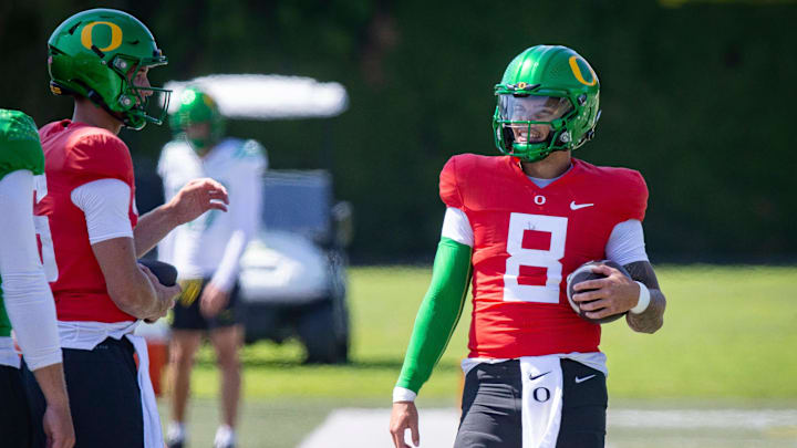 Oregon quarterback Dillon Gabriel walks the field during practice with the Ducks Tuesday, Aug. 13, 2024 at the Hatfield-Dowlin Complex in Eugene, Ore.