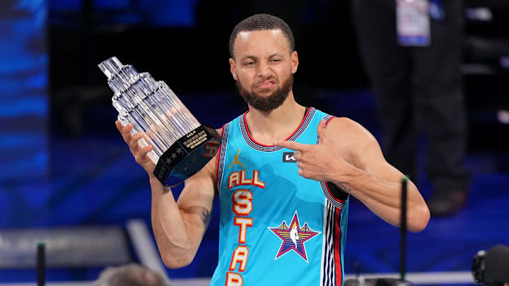 Shaq's OGs guard Stephen Curry of the Golden State Warriors holds up All-Star MVP trophy