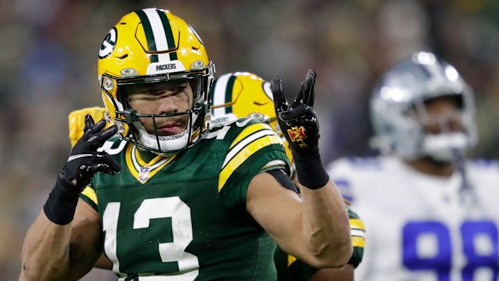 Green Bay Packers wide receiver Allen Lazard (13) celebrates a long first down gain on a reception