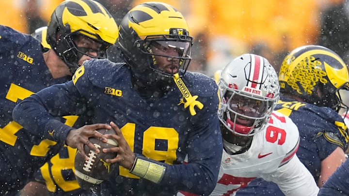 Ohio State Buckeyes defensive end Kenyatta Jackson Jr. (97) sacks Michigan Wolverines quarterback Bryce Underwood (19) during the NCAA football game at Michigan Stadium in Ann Arbor, Mich. on Nov. 29, 2025. Ohio State won 27-9.