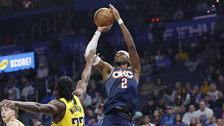 Jan 23, 2026; Oklahoma City, Oklahoma, USA; Oklahoma City Thunder guard Shai Gilgeous-Alexander (2) shoots over Indiana Pacers guard/forward Aaron Nesmith (23) during the first quarter at Paycom Center. Mandatory Credit: Alonzo Adams-Imagn Images