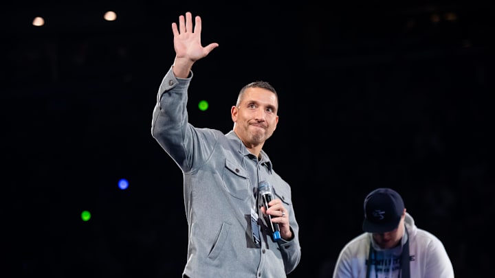 First-year Penn State football head coach Matt Campbell waves to the crowd during a Big Ten wrestling dual meet against Nebraska on January 30, 2026, in State College.