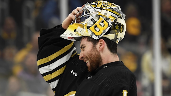 May 12, 2024; Boston, Massachusetts, USA; Boston Bruins goaltender Jeremy Swayman (1) slips on his mask during the second period in game four of the second round of the 2024 Stanley Cup Playoffs against the Florida Panthers at TD Garden. Mandatory Credit: Bob DeChiara-Imagn Images