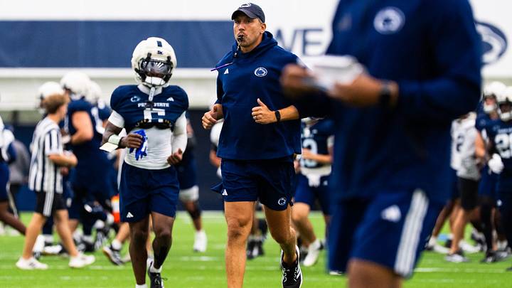 Penn State Nittany Lions football coach Matt Campbell jogs at the start of a practice session inside Holuba Hall. Penn State Nittany Lions football coach Matt Campbell jogs at the start of a practice session inside Holuba Hall.