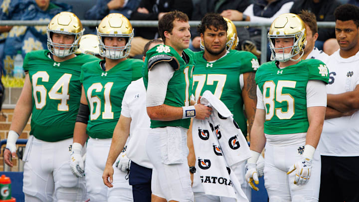 Notre Dame quarterback Riley Leonard (13) sits out for a snap after being banged up on the previous play during a NCAA college football game between Notre Dame and Louisville at Notre Dame Stadium on Saturday, Sept. 28, 2024, in South Bend. Notre Dame quarterback Riley Leonard (13) sits out for a snap after being banged up on the previous play during a NCAA college football game between Notre Dame and Louisville at Notre Dame Stadium on Saturday, Sept. 28, 2024, in South Bend.