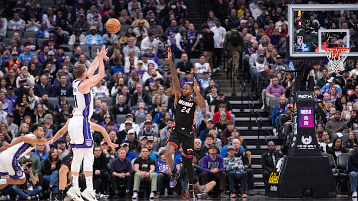 Jan 6, 2025; Sacramento, California, USA; Sacramento Kings forward Domantas Sabonis (11) takes a three point shot against Miami Heat forward Haywood Highsmith (24) during the first quarter at Golden 1 Center. Mandatory Credit: Ed Szczepanski-Imagn Images