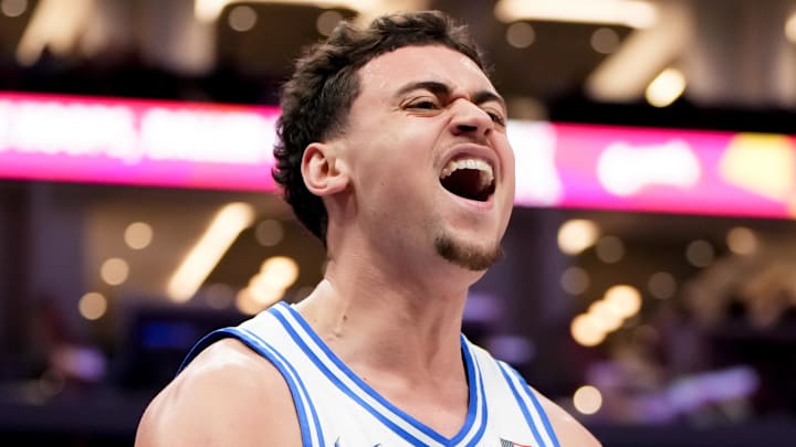 Mar 14, 2026; Charlotte, NC, USA; Duke Blue Devils guard Darren Harris (8) celebrates after a play against the Virginia Cavaliers during the men's ACC Conference Tournament Championship at Spectrum Center. Mandatory Credit: Bob Donnan-Imagn Images
