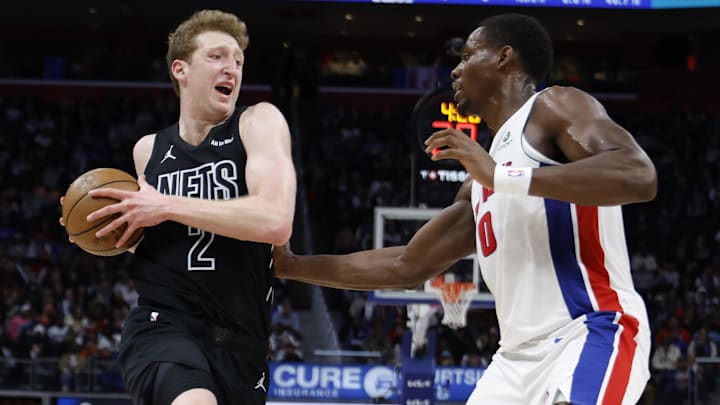 Feb 1, 2026; Detroit, Michigan, USA;  Brooklyn Nets forward Danny Wolf (2) dribbles defended by Detroit Pistons center Jalen Duren (0) in the first half at Little Caesars Arena. Mandatory Credit: Rick Osentoski-Imagn Images