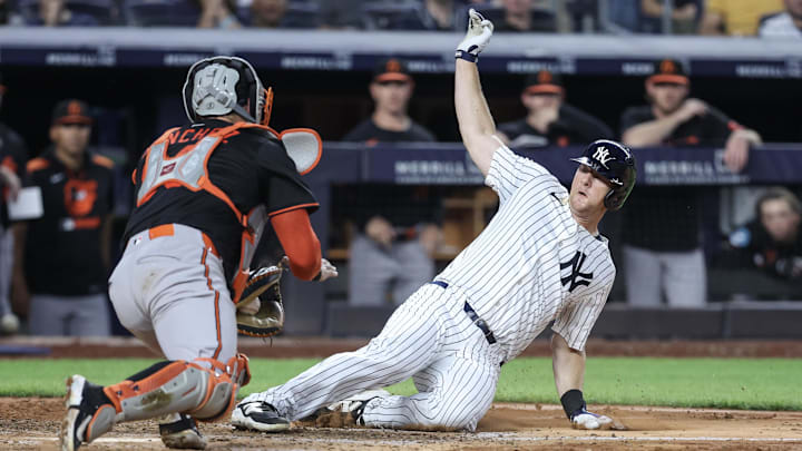 Bronx, New York, USA; New York Yankees second baseman DJ LeMahieu (26) is tagged out at home plate by Baltimore Orioles catcher Gary Sánchez (99) in the fourth inning at Yankee Stadium.