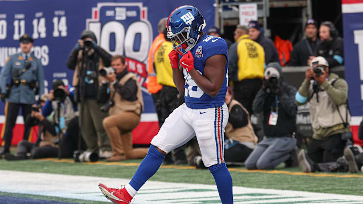 Nov 24, 2024; East Rutherford, New Jersey, USA; New York Giants running back Devin Singletary (26) celebrates after his rushing touchdown during the second half against the Tampa Bay Buccaneers at MetLife Stadium. Nov 24, 2024; East Rutherford, New Jersey, USA; New York Giants running back Devin Singletary (26) celebrates after his rushing touchdown during the second half against the Tampa Bay Buccaneers at MetLife Stadium.