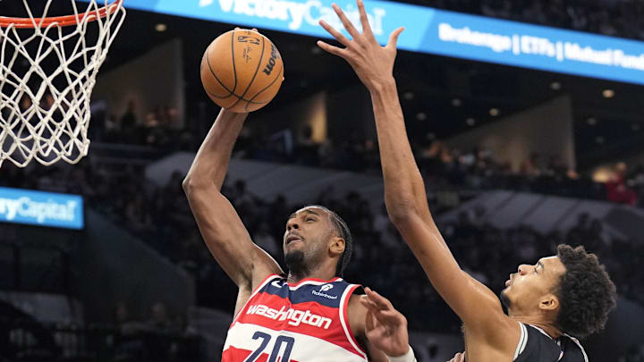 Nov 13, 2024; San Antonio, Texas, USA; Washington Wizards forward Alex Sarr (20) goes up to dunk while defended by San Antonio Spurs center Victor Wembanyama (1) during the second half at Frost Bank Center. Mandatory Credit: Scott Wachter-Imagn Images Nov 13, 2024; San Antonio, Texas, USA; Washington Wizards forward Alex Sarr (20) goes up to dunk while defended by San Antonio Spurs center Victor Wembanyama (1) during the second half at Frost Bank Center. Mandatory Credit: Scott Wachter-Imagn Images